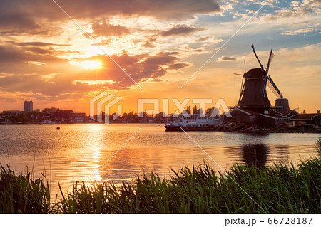 Windmills at Zaanse Schans in Holland on sunset. Zaandam, Nether 66728187