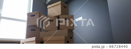 Lot of cardboard boxes on wooden floor new flat closeup 66728440