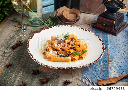 Rigatoni pasta putanesca with olives anchovies Rigatoni pasta putanesca with olives anchovies 66729438