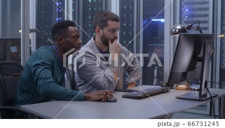 Young programmers working in data center 66731245