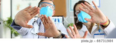 Male and female doctors examined protective masks Male and female doctors examined protective masks 66731984