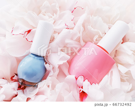 Nail polish bottles on floral background, french manicure and cosmetic branding Nail polish bottles on floral background, french manicure and cosmetic branding 66732492