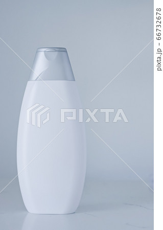Blank label cosmetic container bottle as product mockup on gray background Blank label cosmetic container bottle as product mockup on gray background 66732678
