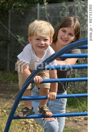 A Boy With Cochlear Implants Playing in Park A Boy With Cochlear Implants Playing in Park 66733360