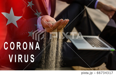 Concept of coronavirus quarantine. sand flows between the fingers of a man Concept of coronavirus quarantine. sand flows between the fingers of a man 66734317