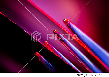 Edges of two illuminated  serrated knives and Edges of two illuminated  serrated knives and 66734708