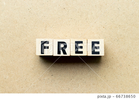 Letter block in word free on wood background Letter block in word free on wood background 66738650