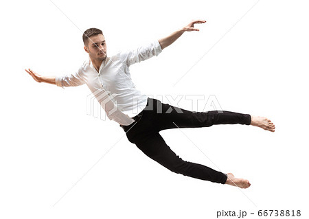 Mid-air beauty. Full length studio shot of attractive young man hovering in air and keeping eyes closed 66738818