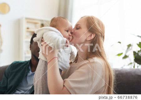 Mother Kissing Baby Mother Kissing Baby 66738876