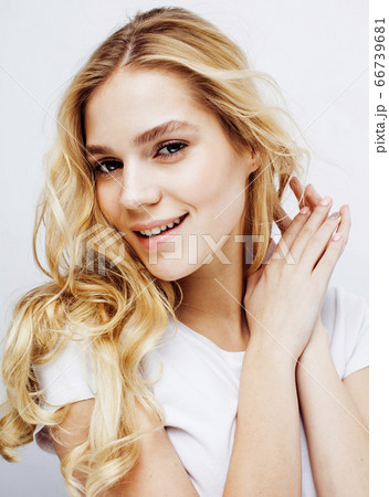 young pretty stylish hipster blond girl posing emotional isolated on white background happy smiling cool smile, lifestyle people concept young pretty stylish hipster blond girl posing emotional isolated on white background happy smiling cool smile, lifestyle people concept 66739681