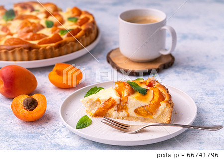 Apricot mascarpone tart, on blue background. Apricot mascarpone tart, on blue background. 66741796