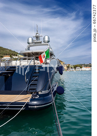 Blue and silver motor yacht in the port of Portovenere Liguria Italy 66742377
