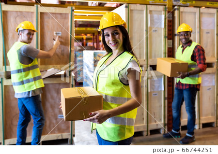 White warehouse worker hold boc portrait with her 66744251