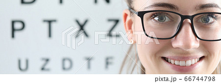 Happy young optician at work 66744798