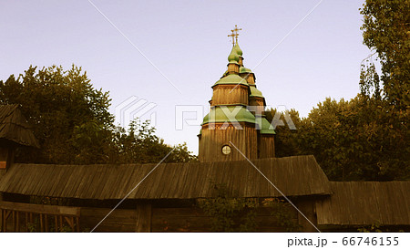 Wooden church with green domes. 66746155