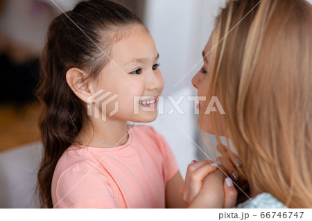 Happy Kid Girl Holding Hands With Mother Indoors 66746747