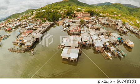 Philippine slums on the beach. Poor area of the city. Coron. Palawan. Philippines. Philippine slums on the beach. Poor area of the city. Coron. Palawan. Philippines. 66748101