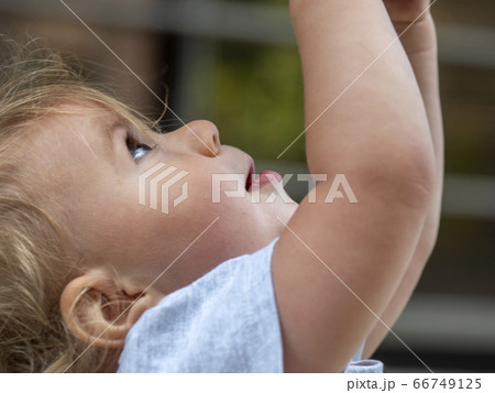 head shot of cute girl looking up head shot of cute girl looking up 66749125