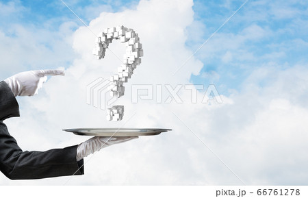 Hand of waiter presenting question mark on tray. Hand of waiter presenting question mark on tray. 66761278