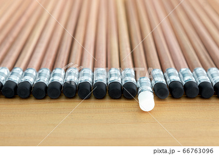 Wooden pencils with black eraser place on Wood background And Close Up , One pencil singled out 66763096