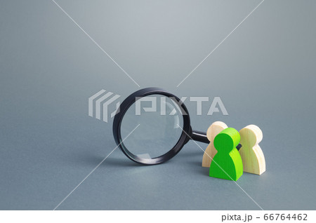 Figures of people stand near a magnifying glass. Search for jobs and vacancies. Human resources. Contractors and performers. Recruiting specialists and professionals, staffed teams, outsourcing. 66764462