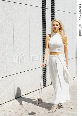 Woman wearing crop top and culottes Woman wearing crop top and culottes 66768283