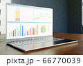 Enterprise financial report with graphs and charts on a screen of modern laptop on wooden table. Selective focus on screen. Copy space at blurry background. Profit growth chart. Close-up. 3d rendering 66770039