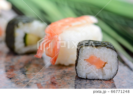Asian sushi served on a marble plate Asian sushi served on a marble plate 66771248
