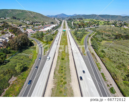 Aerial view of highway, freeway road with vehicle in movement 66772012
