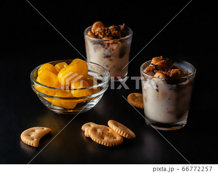yogurt dessert with toppings on a dark background 66772257