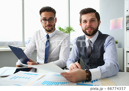 Joyful business colleagues working together in office 66774357