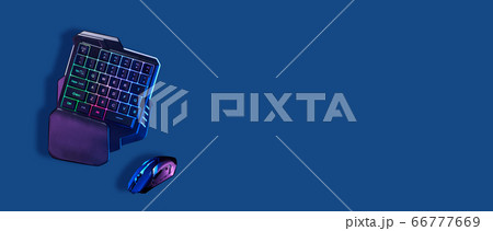 Games keyboard and mouse on blue background. 66777669