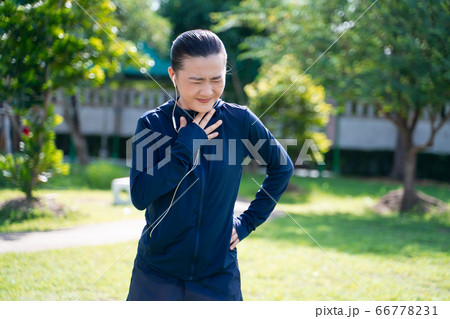 Portrait of Asian woman wearing earphones Portrait of Asian woman wearing earphones 66778231
