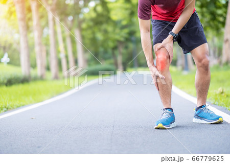 Young adult male with muscle pain during running. 66779625