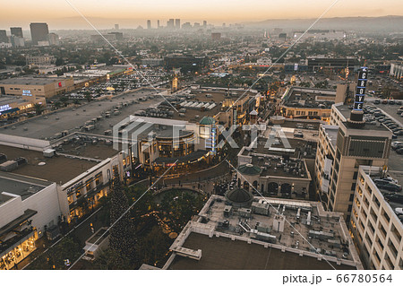 The Grove Shopping Center in Los Angeles at Sunset with Shops and Hollywood Skyline in the distance 66780564