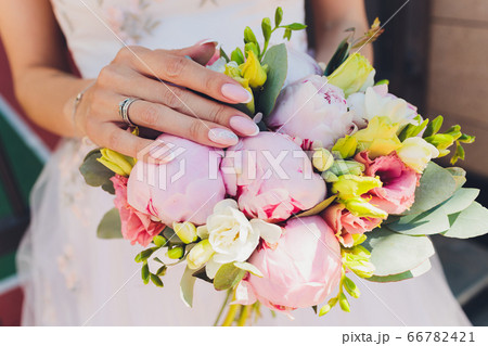 Beautiful bridal bouquet with roses and peonies. 66782421