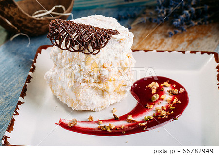 Dessert count ruins airy biscuit with berry sauce 66782949