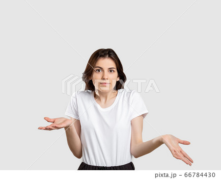 shrug gesture confused woman raising shoulders shrug gesture confused woman raising shoulders 66784430
