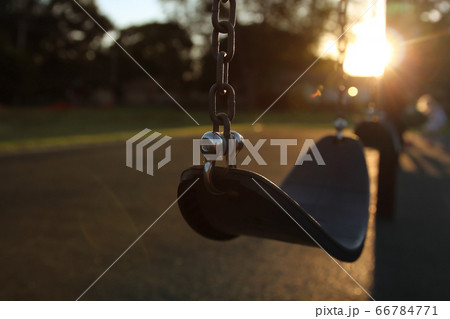 Empty children playground swing during the coronavirus quarantine 66784771
