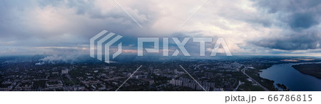 panoramic view of the city with river . Smog from industrial zone over city.  66786815