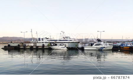 Izmit Port, Turkey - June 5, 2020: Izmit port and boats at the pier landscape. Izmit Port, Turkey - June 5, 2020: Izmit port and boats at the pier landscape. 66787874