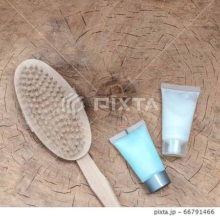 Spa accessories - scrub, facial brush, clay face mask, on a light wooden background Spa accessories - scrub, facial brush, clay face mask, on a light wooden background 66791466