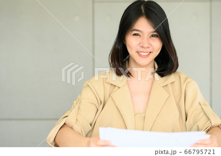 smiling Asian woman in modern office 66795721