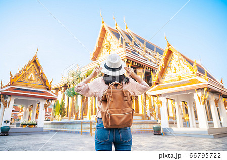 Back view of tourist woman enjoy travel in temple Back view of tourist woman enjoy travel in temple 66795722