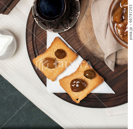 Two slice of toast with plum confiture Two slice of toast with plum confiture 66797203