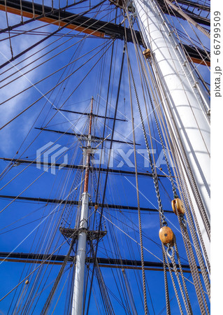 Old ship mast and sail ropes closeup 66799509