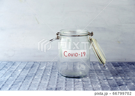 Empty money jar with covid19 label Empty money jar with covid19 label 66799702
