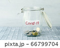 Money jar with covid19 label 66799704