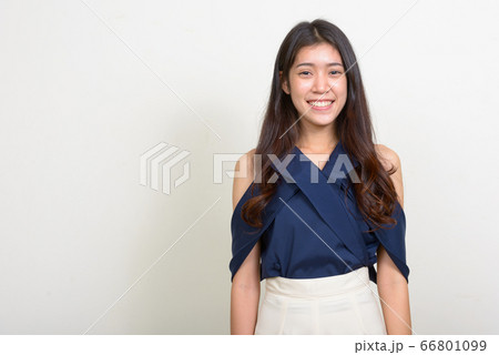 Portrait of happy young beautiful Asian businesswoman smiling Portrait of happy young beautiful Asian businesswoman smiling 66801099