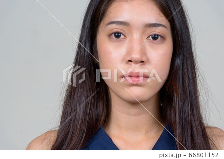 Face of young beautiful Asian businesswoman looking at camera 66801152